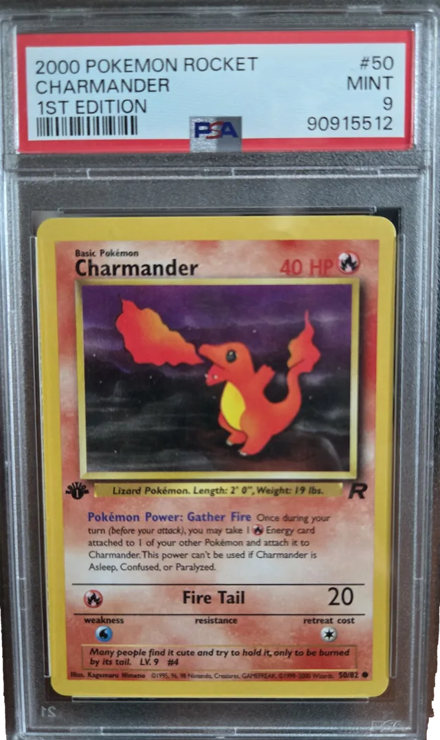 A graded first edition Charmander from the 2000 Team Rocket set in a PSA holder labelled MINT 9